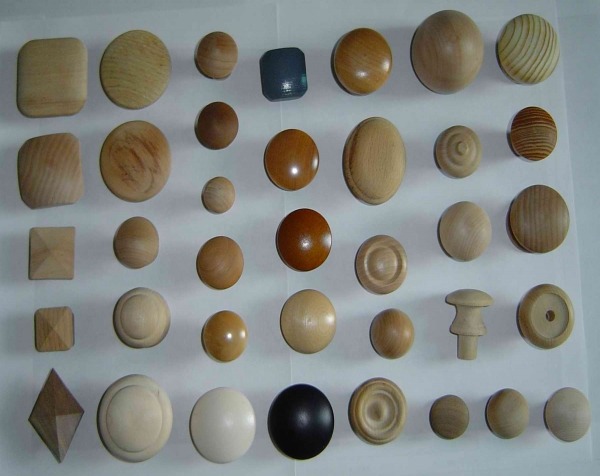 Assorted wooden knobs in finished, painted, and unfinished options, available in bulk for high-volume production.